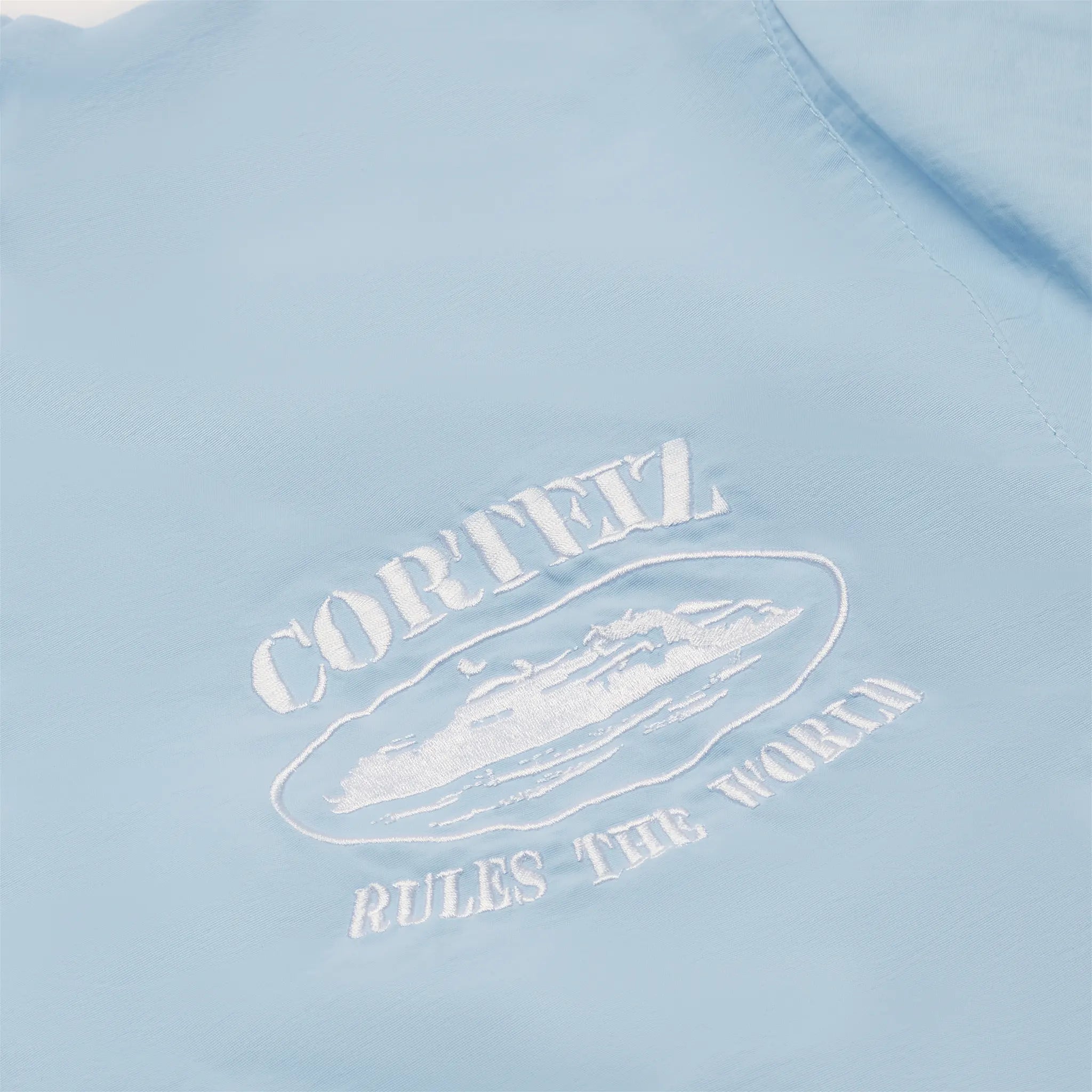 Chest view of Corteiz Shukushuku Baby Blue Tracksuit